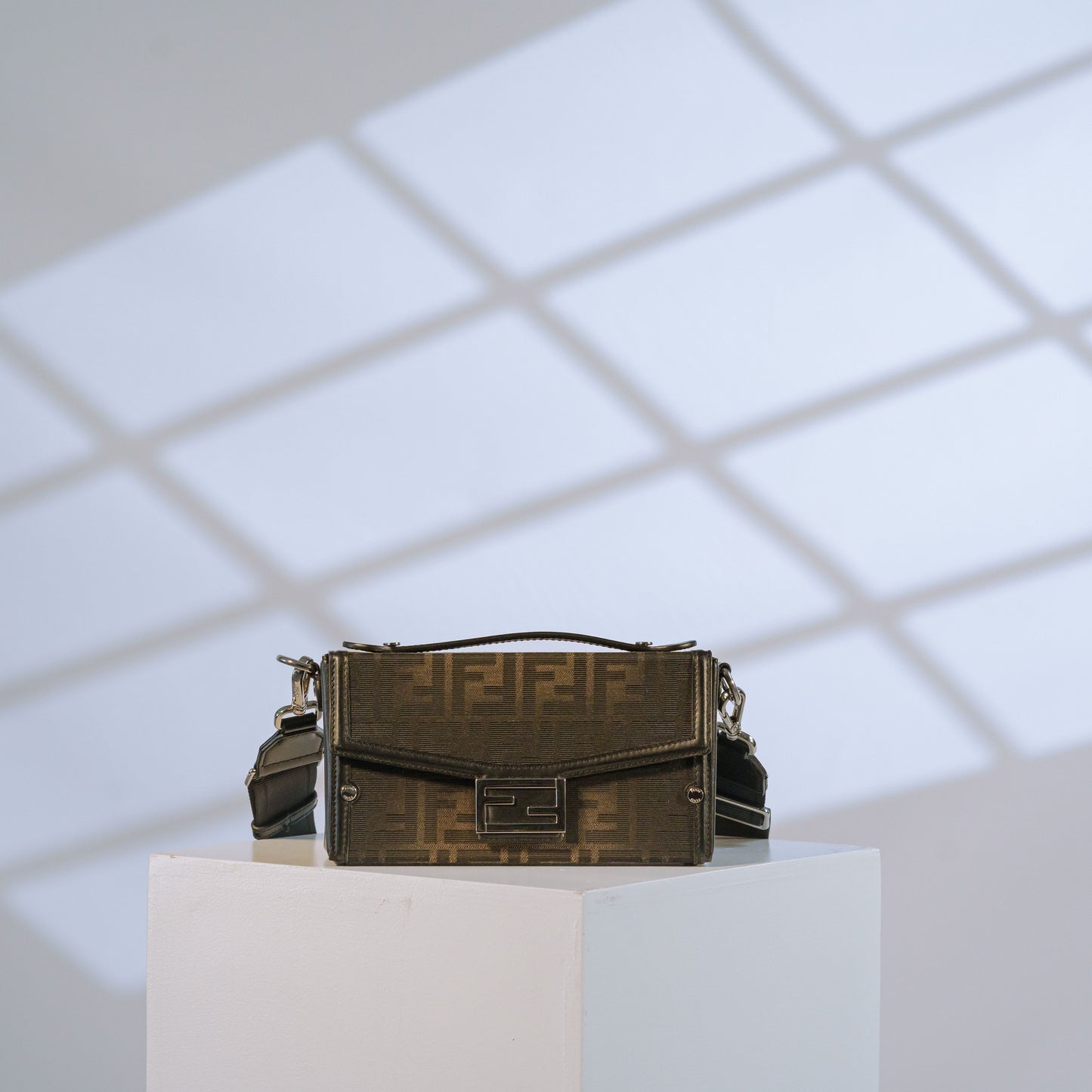 Fendi Zucca print mini crossbody bag with black leather trim and silver hardware, front view