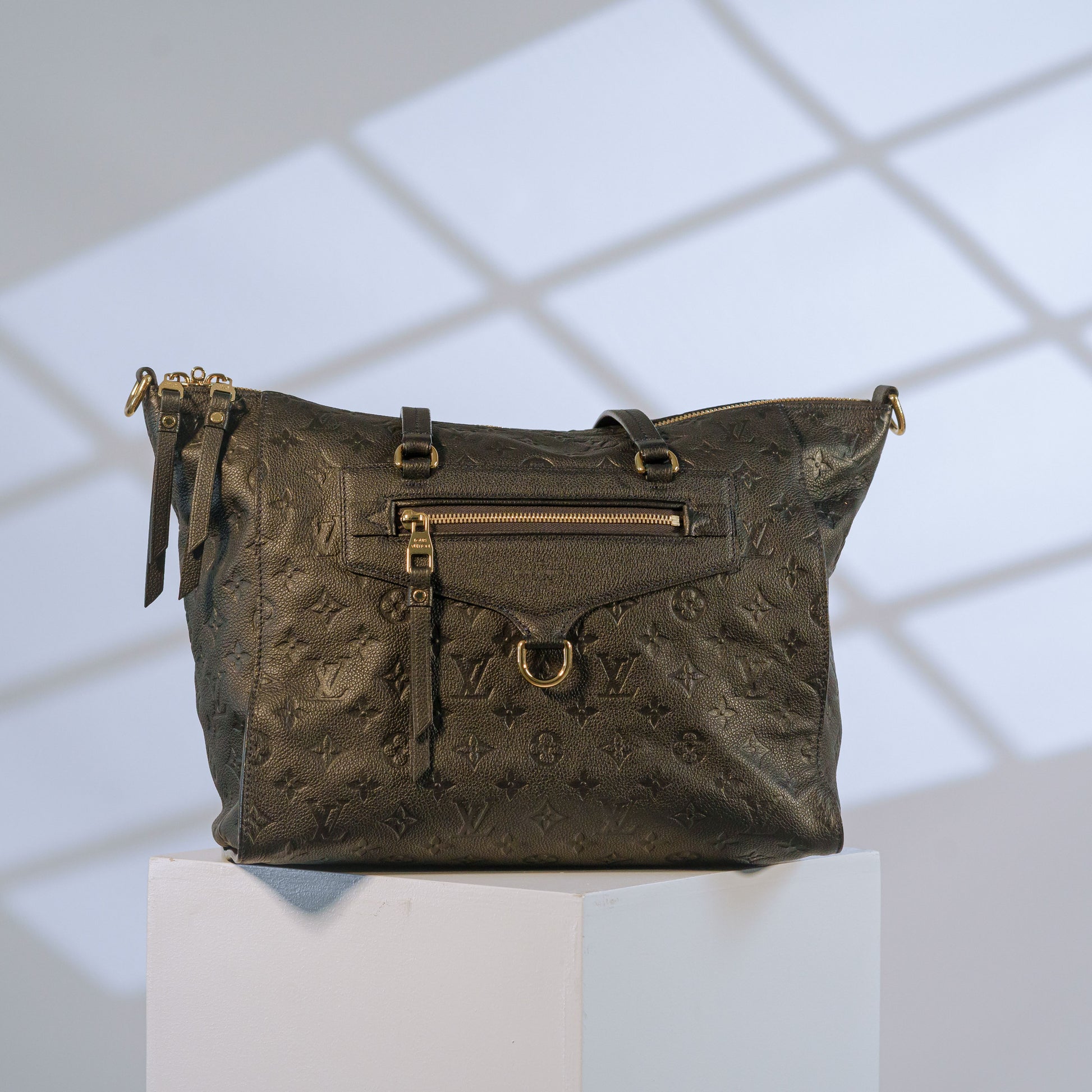 Louis Vuitton black Empreinte leather tote bag with gold hardware and zip front pocket
