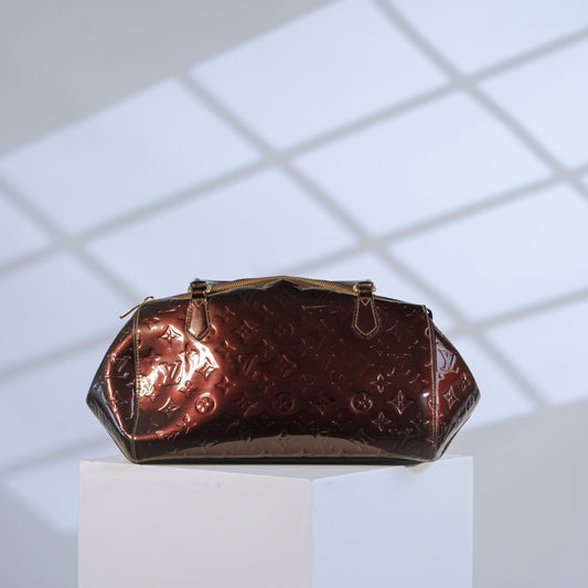 Louis Vuitton Vernis Monogram handbag in burgundy patent leather with gold-tone hardware, front view
