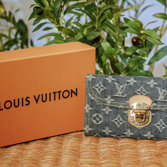 Louis Vuitton Monogram Denim Wallet with gold S-lock and orange box
